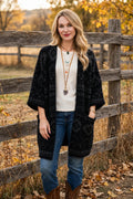 Aztec soft knit cardigan in Black, worn with jeans and cowboy boots