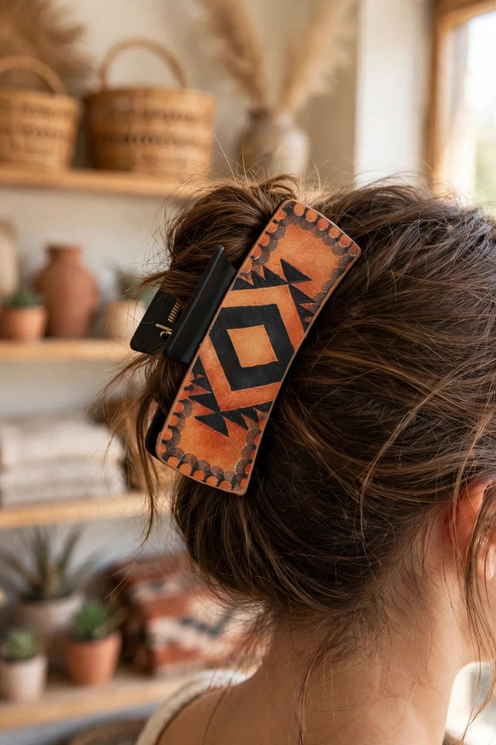 Aztec Sunset hair claw clip shown in a woman's updo